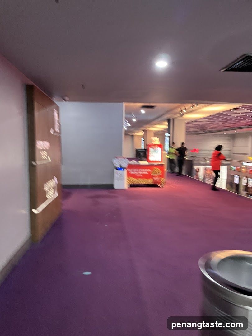 Purple carpeted corridor with promotional display