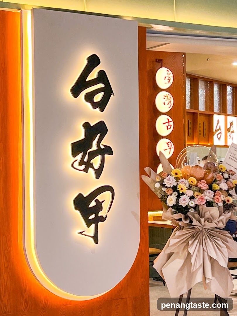 Tai Hoo Ah Signage with Floral Arrangement