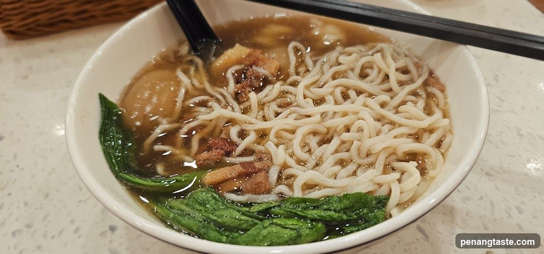 Bowl of Noodles with Broth and Greens