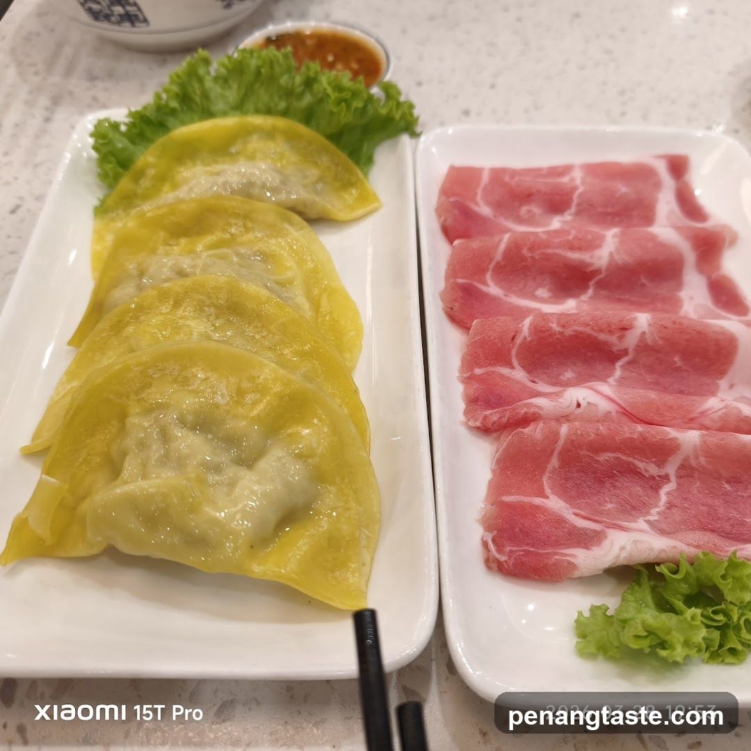 Dining Table with Dumplings and Meat Slices