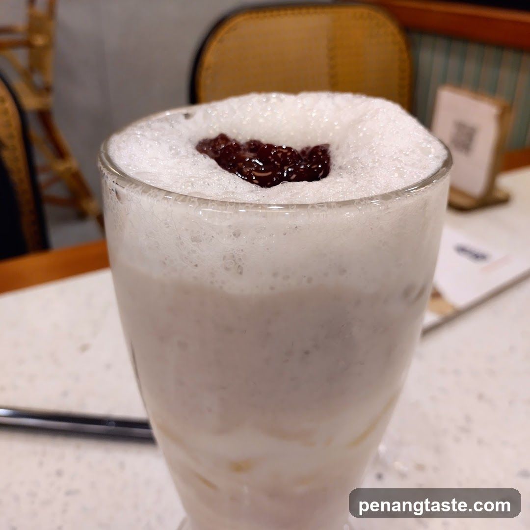 Foamy Milk Drink with Red Topping
