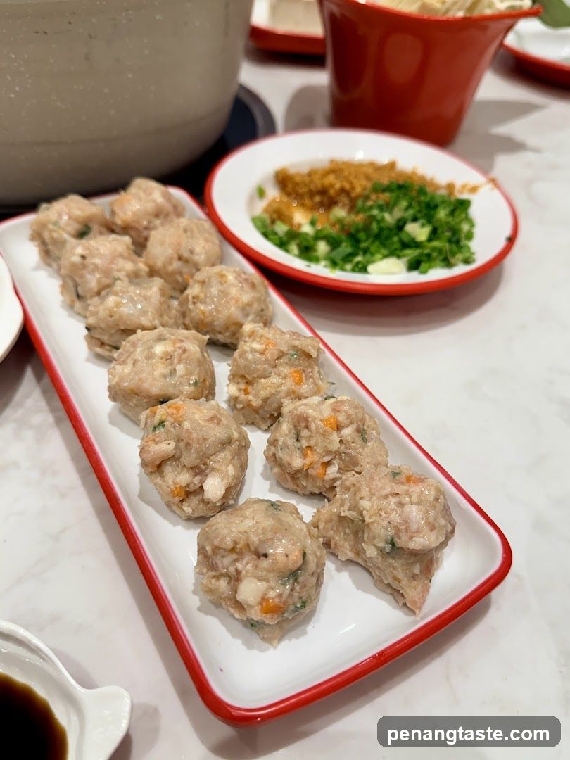 Meatballs with dipping sauce and garnish