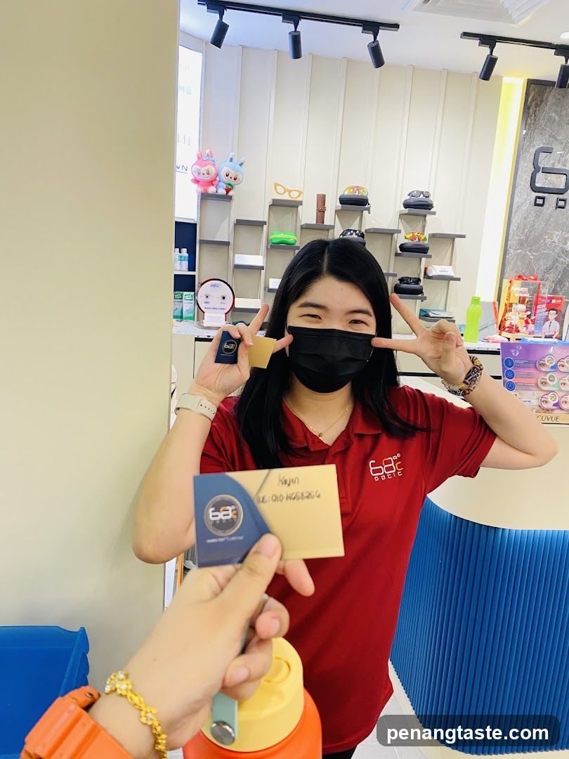 Staff holding business cards in store interior