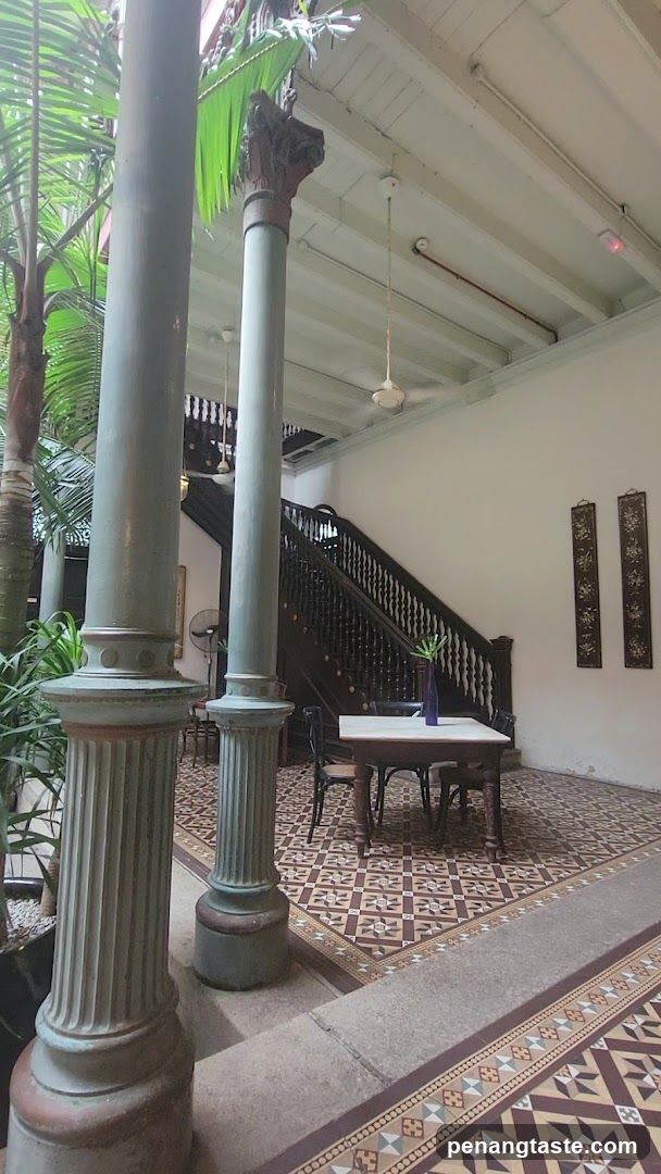Interior of a building with columns and staircase