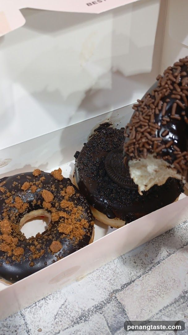 Chocolate Donuts with Crumbs and Sprinkles