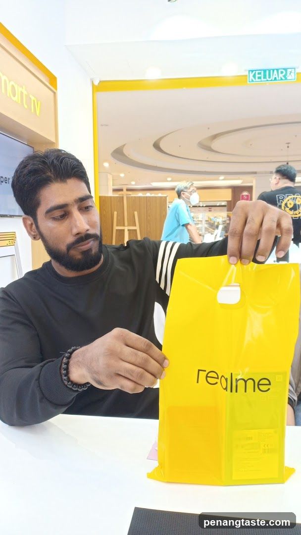 Customer holding realme shopping bag