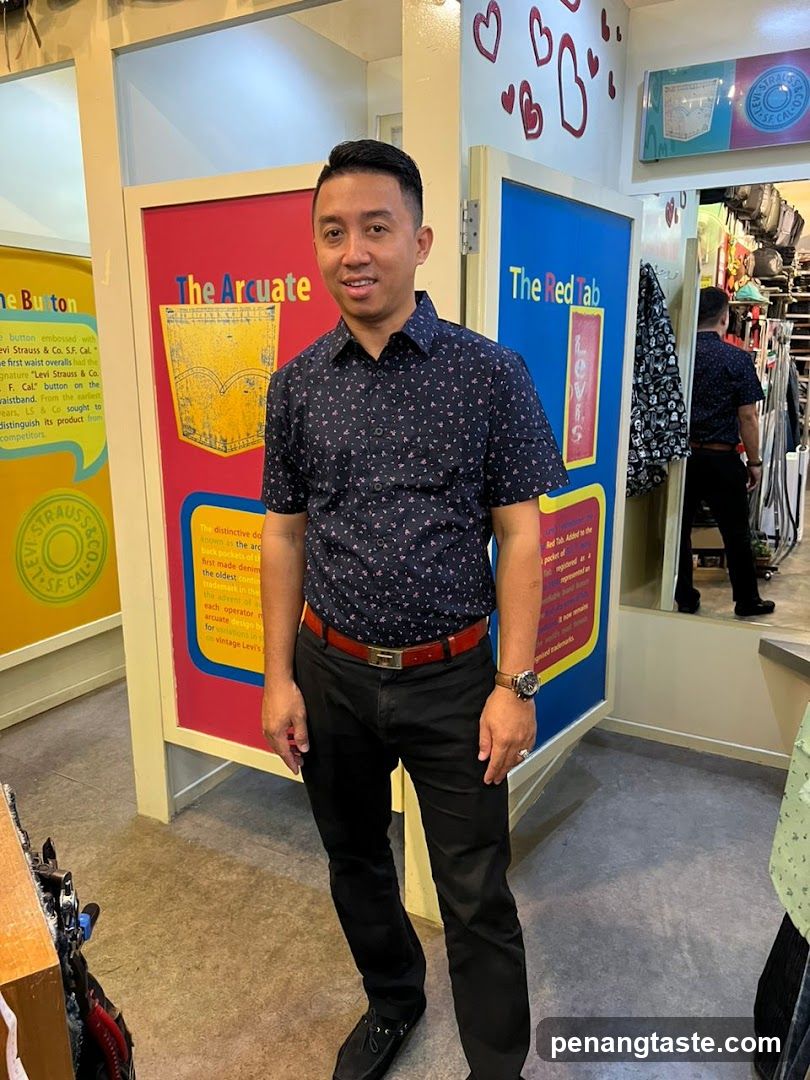 Man in Patterned Shirt Standing Inside Store