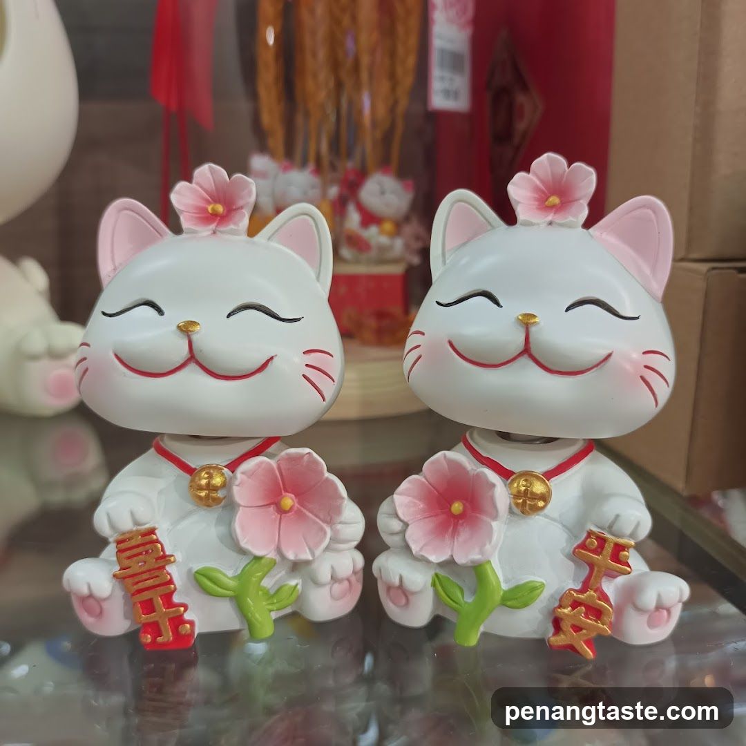 Maneki-neko figurines with flowers