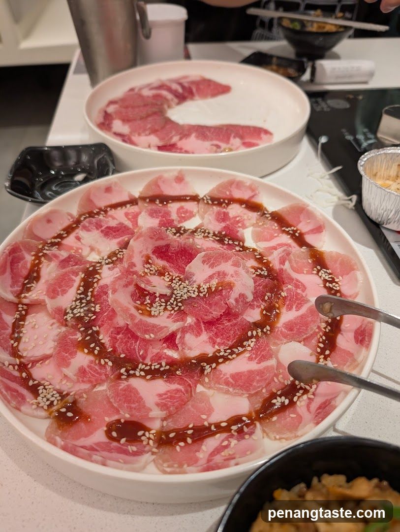 Sliced Meat Platter with Sauce and Sesame Seeds