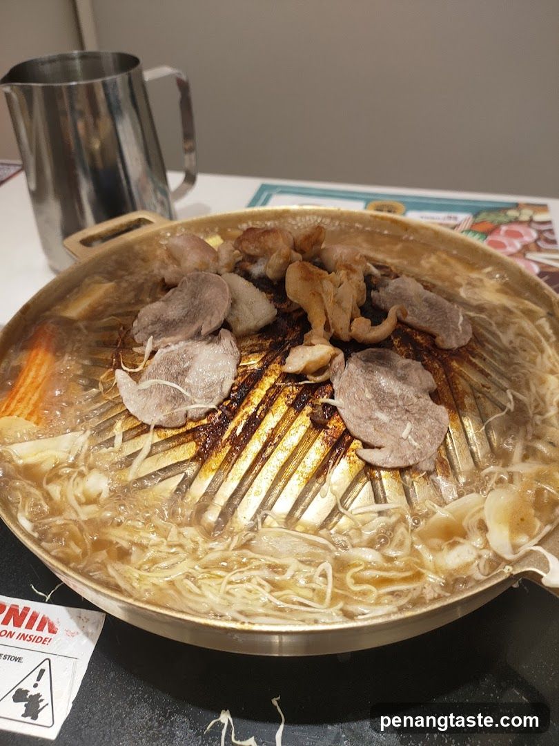 Grilled Meat and Noodles in a Hot Pot