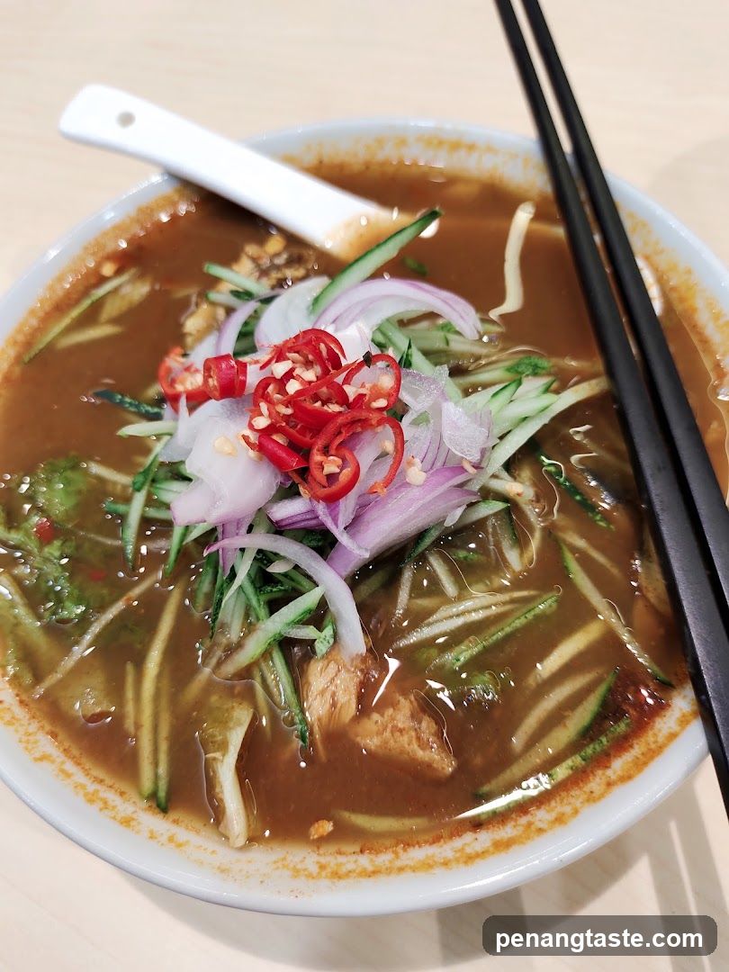 Bowl of Spicy Noodle Soup with Toppings