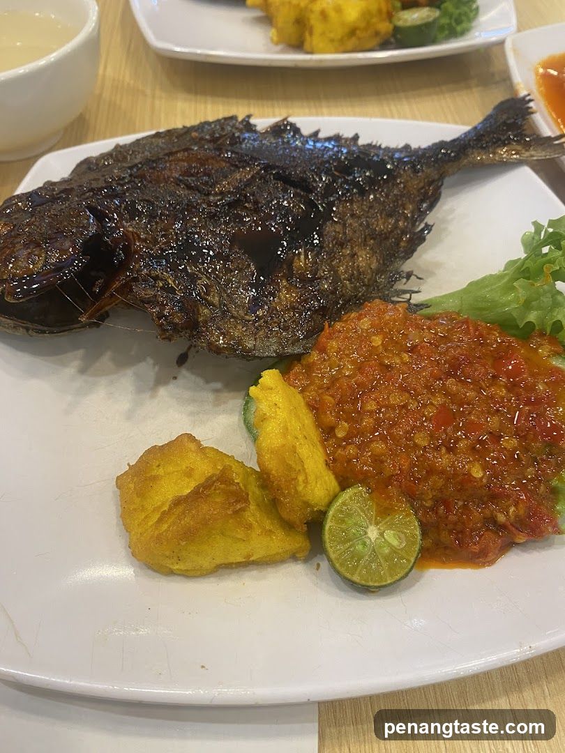 Fried Fish with Sambal and Side Dishes