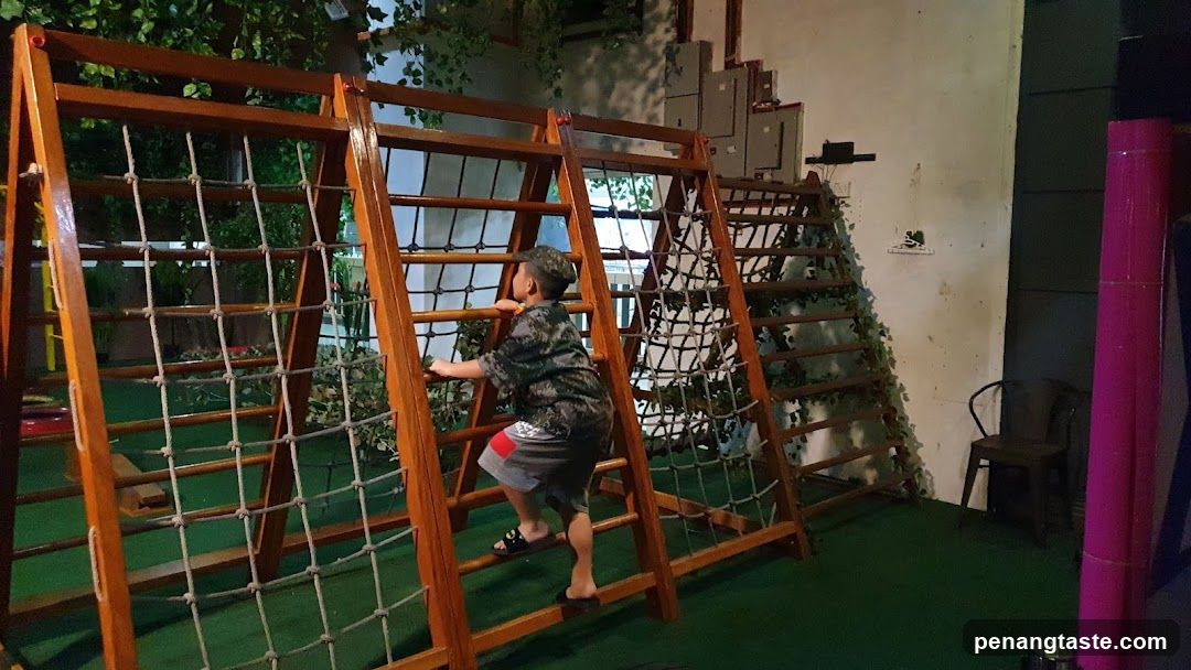 Child Climbing Indoor Play Structure