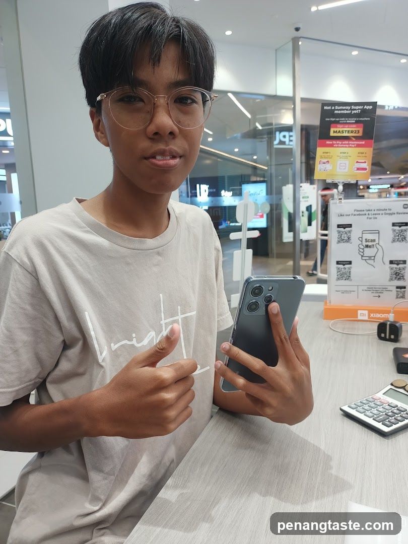 Person holding smartphone in store