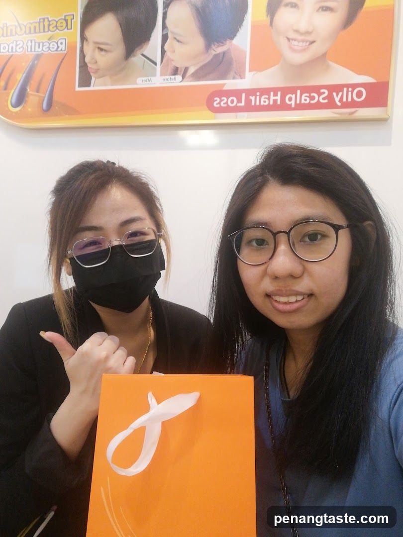 Two women with hair loss treatment bag