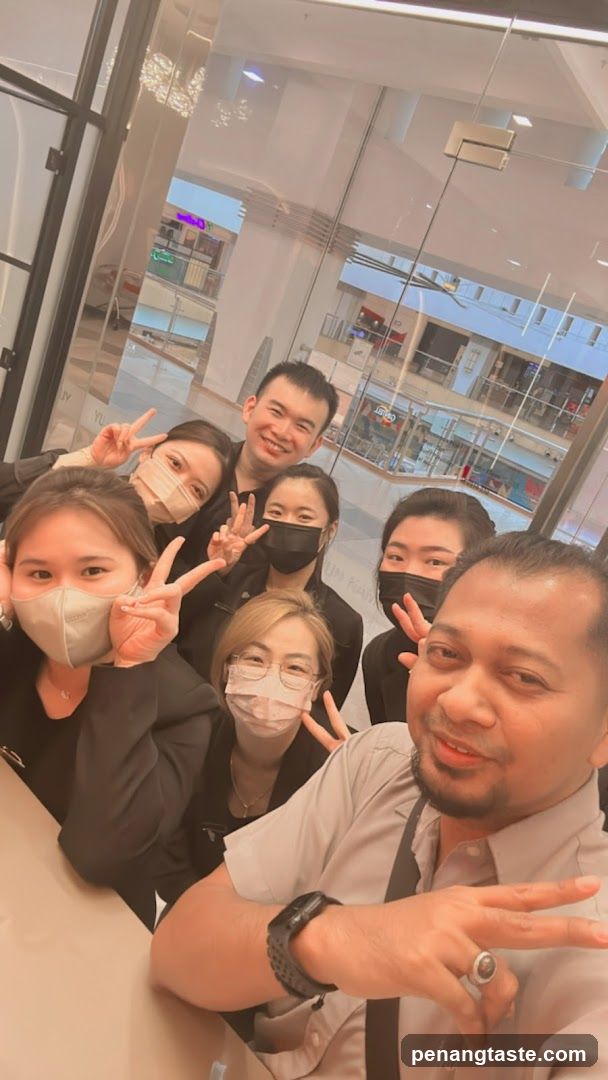 Group selfie with masks and peace signs