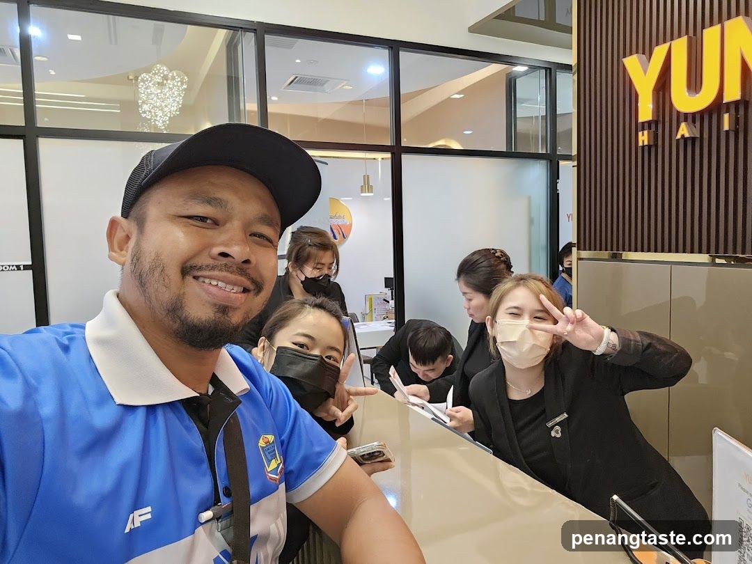 Group selfie at reception desk