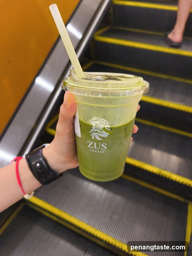 Zus Coffee Drink on Escalator