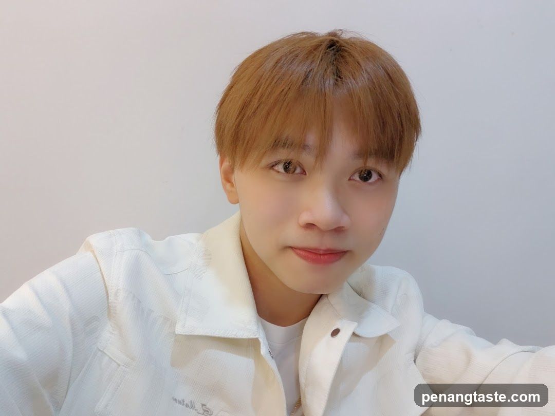 Selfie of a person in white jacket