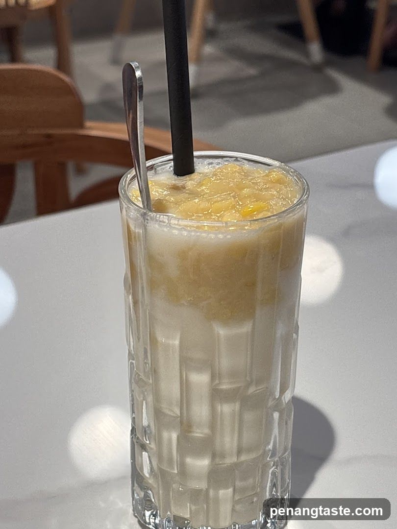 Iced Mango Milkshake with Straw and Spoon