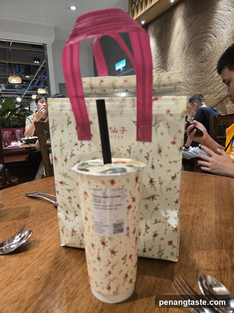 Boba Tea and Bag at Restaurant Table