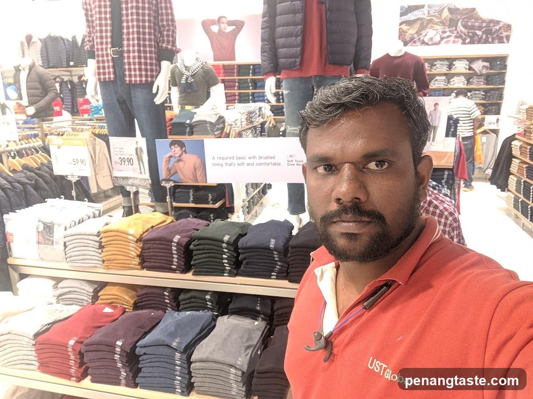 Man in Red Shirt at Clothing Store