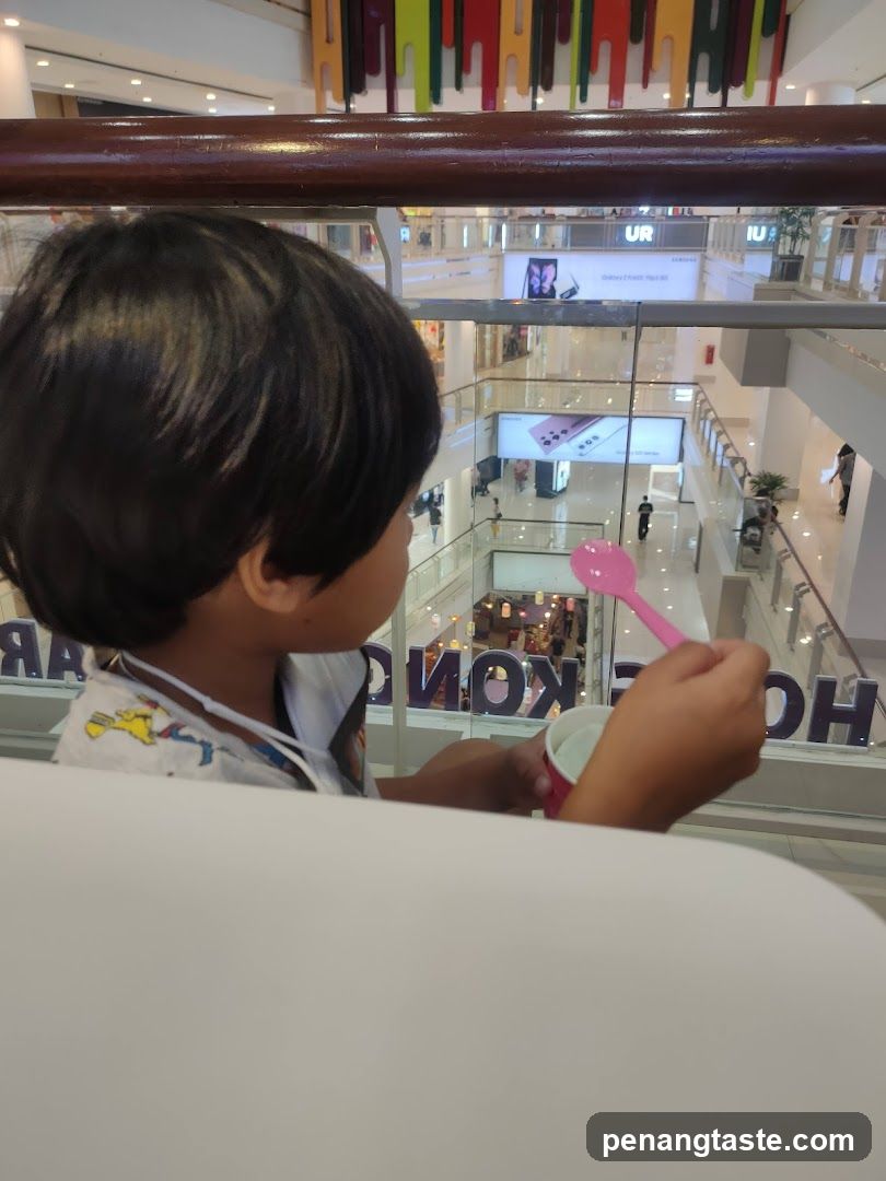 Child in Mall Holding Ice Cream
