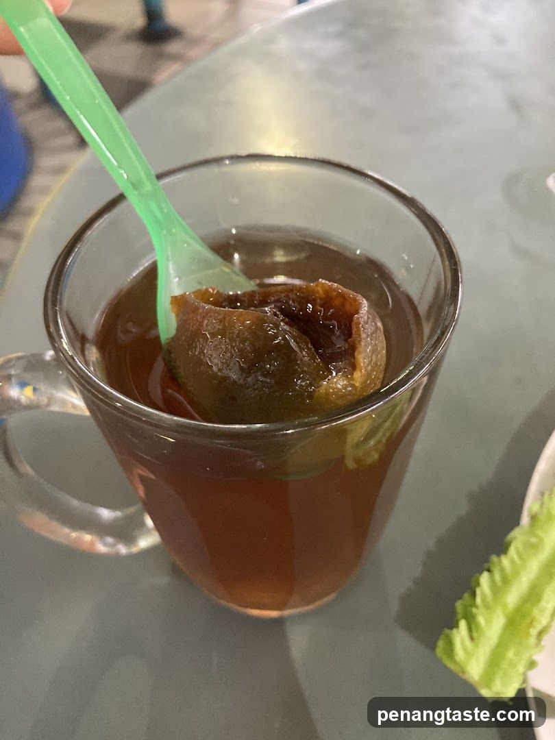 Tea with fruit in glass cup