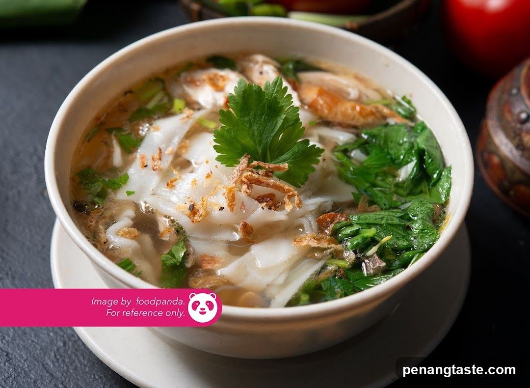 Bowl of Noodle Soup with Greens and Crispy Toppings
