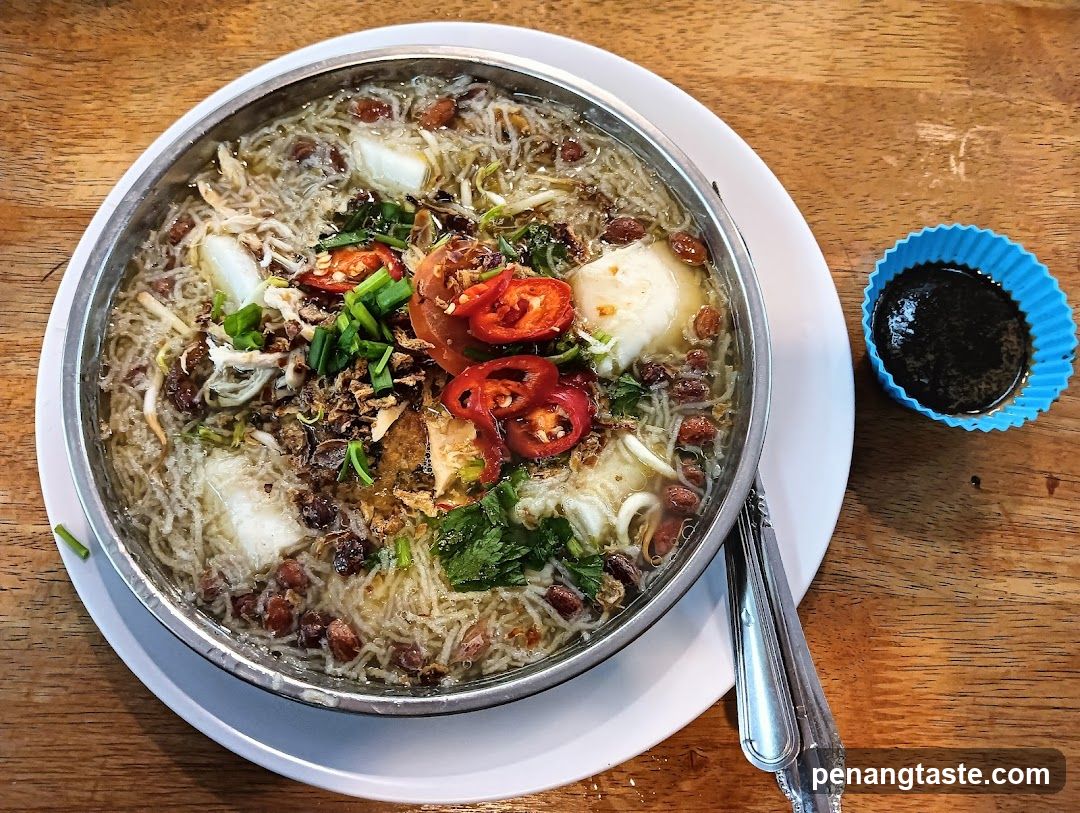 Bowl of Noodle Soup with Chili and Tofu