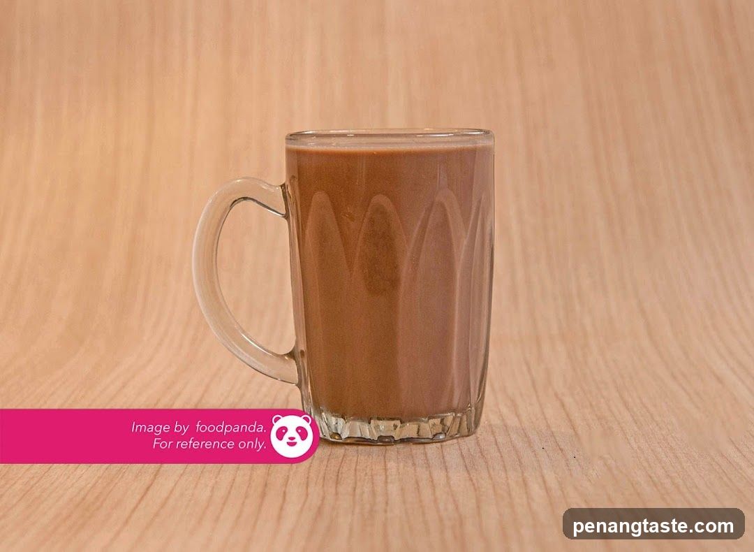 Glass Mug of Brown Beverage