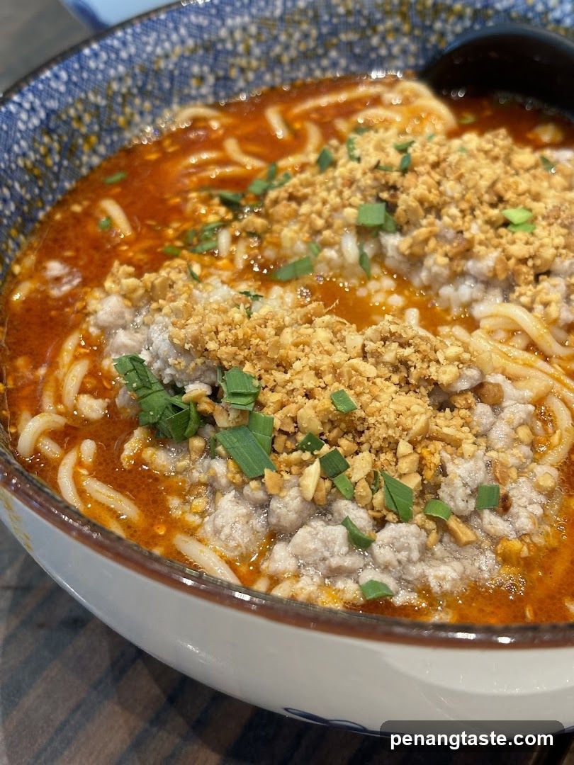 Bowl of Noodle Soup with Minced Meat and Crumbs