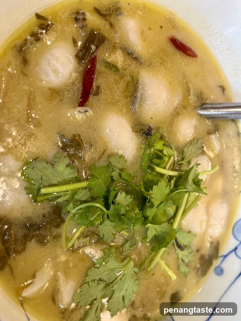 Spicy Fish Soup with Pickled Vegetables and Cilantro