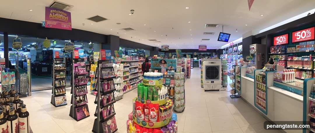 Interior of a well-lit retail store with aisles and promotional displays.