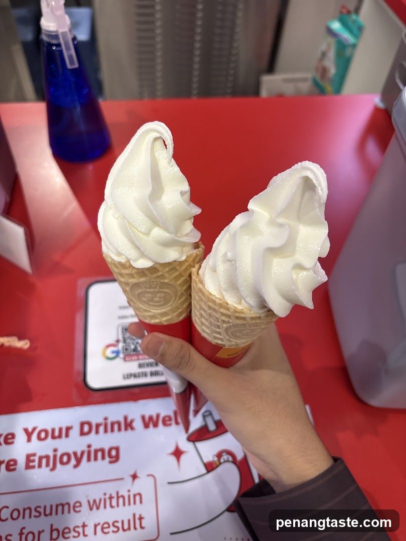Soft-serve ice cream cones at a counter