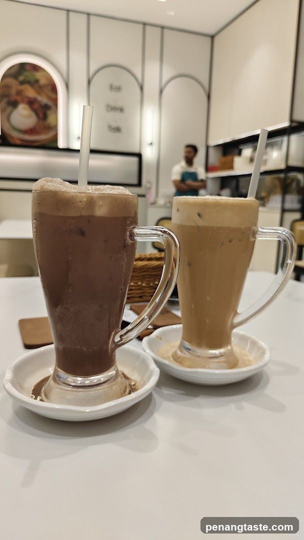 Two Iced Coffee Drinks in Glass Mugs