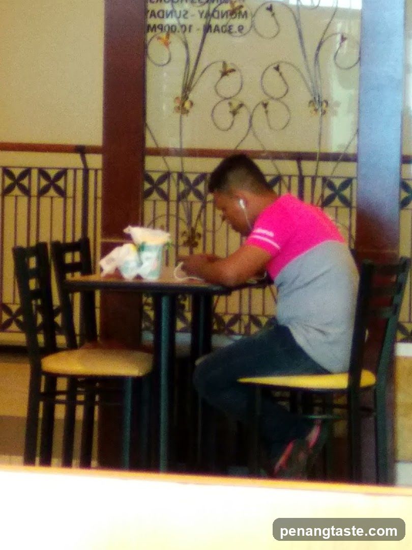 Person eating at a table in a restaurant