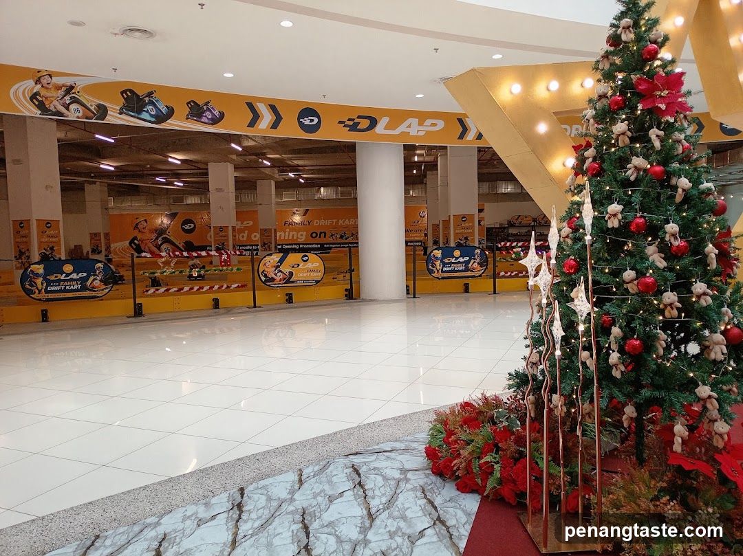 Shopping Mall Interior with Christmas Tree and Go-Kart Track
