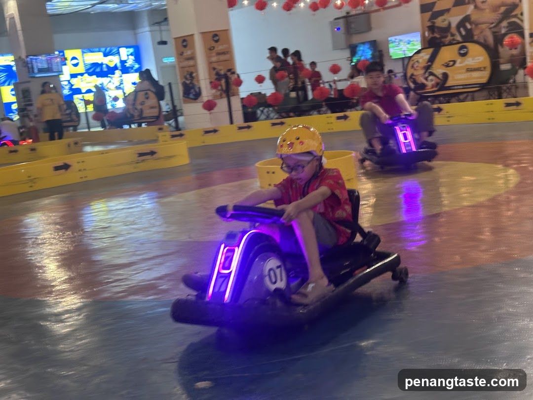 Kids Driving Go-Karts in Indoor Arena