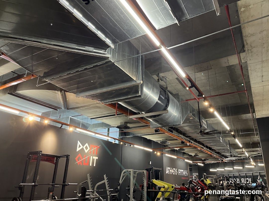 Gym Interior with Exposed Ducts and Equipment