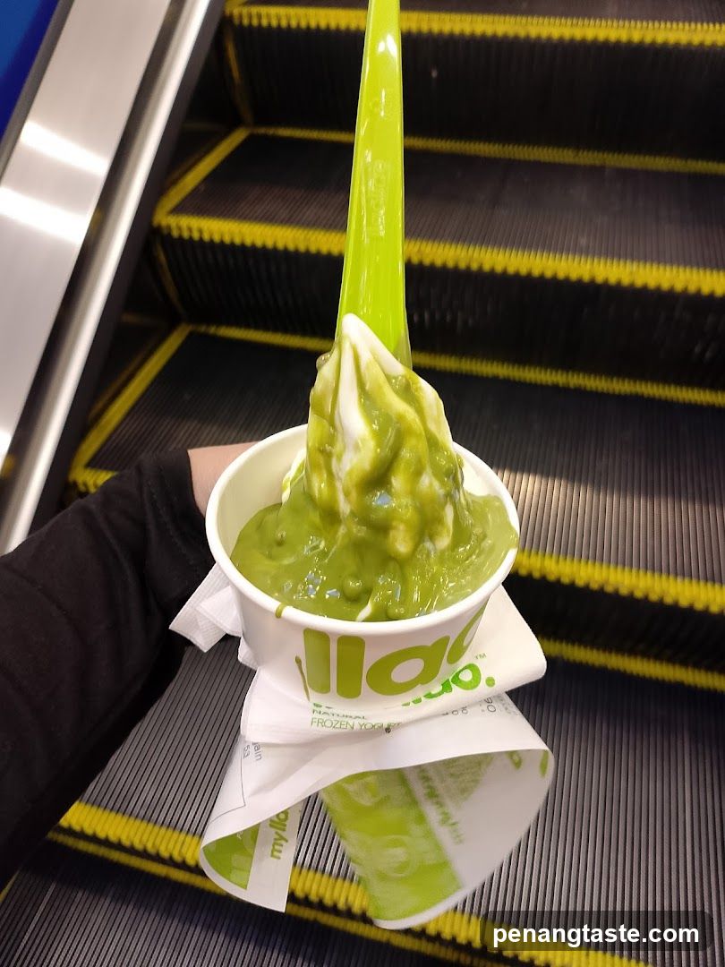 Matcha Frozen Yogurt Cup on Escalator