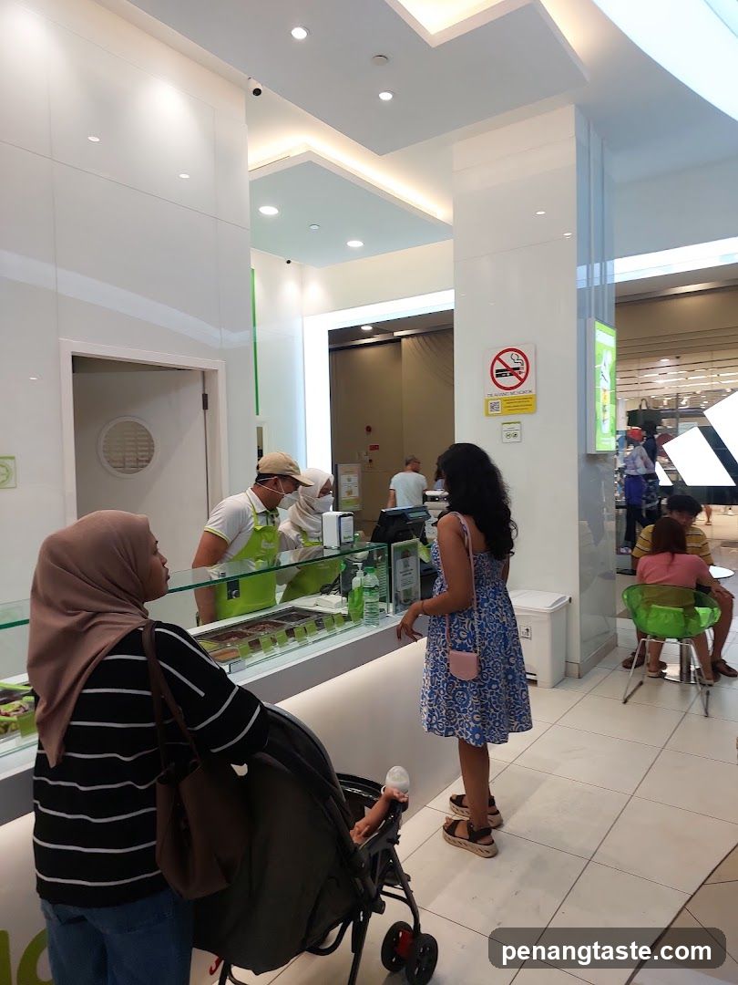 Customers at a food counter in a mall