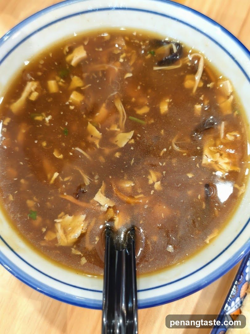 Bowl of Soup with Chopsticks