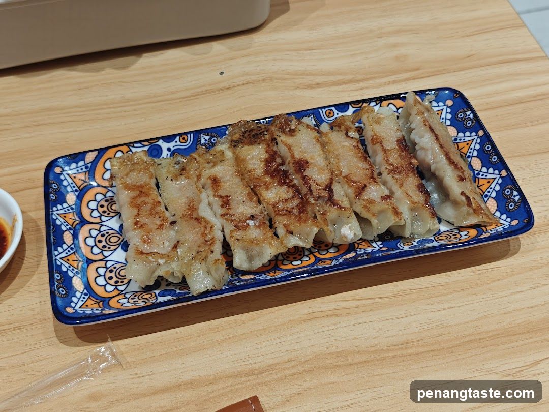 Pan-fried Dumplings on Decorative Plate