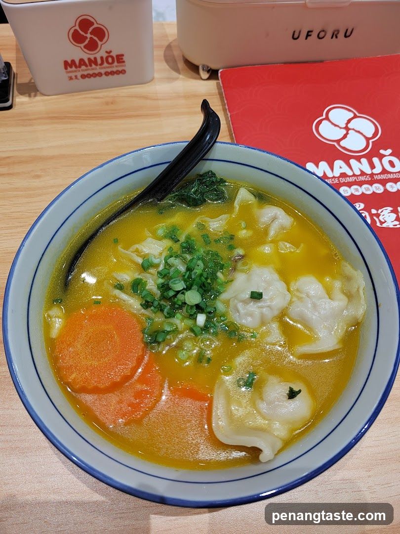 Bowl of dumpling soup with garnish