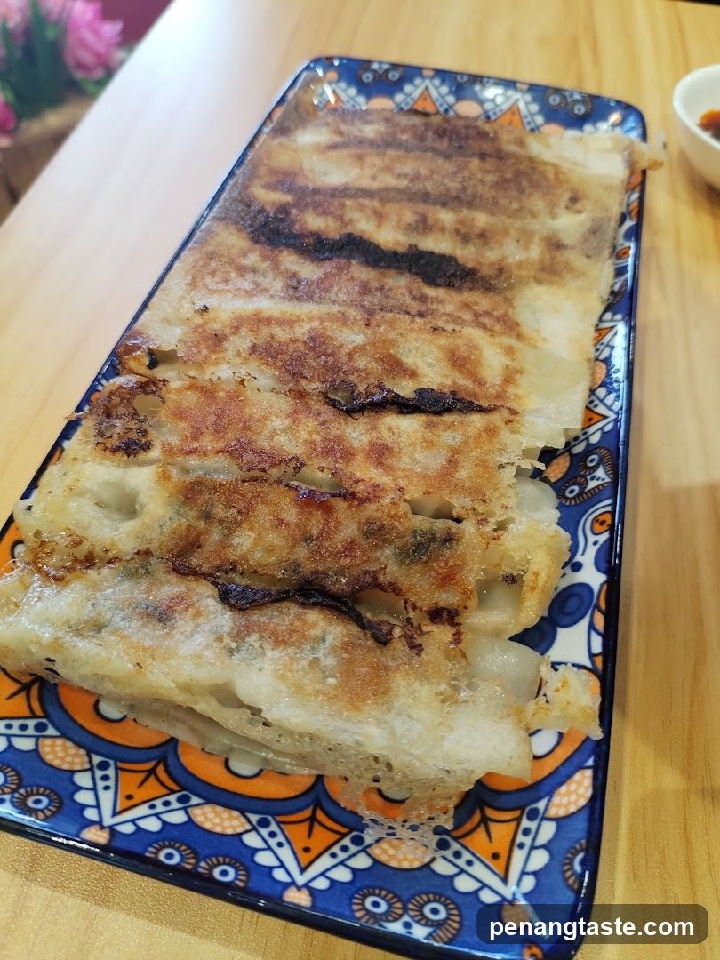 Pan-Fried Dumplings on Decorative Plate