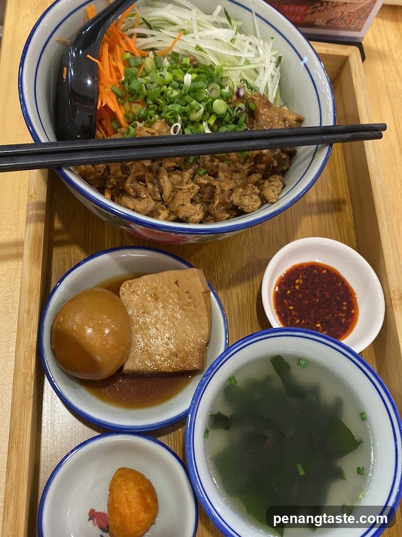 Bowl of meat with toppings and side dishes