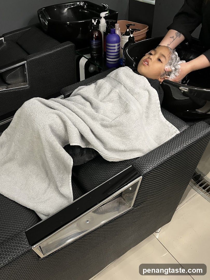Child Getting Hair Washed at Salon