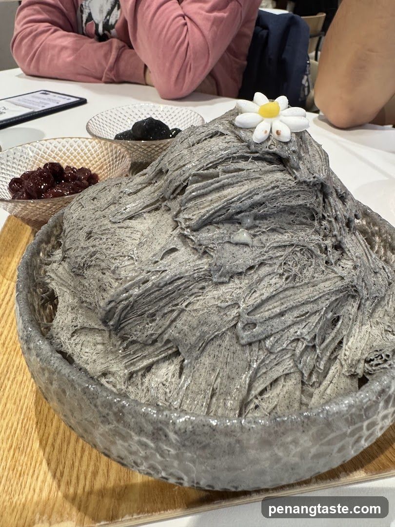 Dessert with Gray Frosting and Flower Decoration