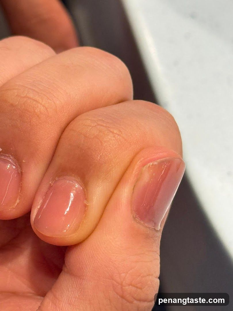 Close-up of fingernails with natural polish
